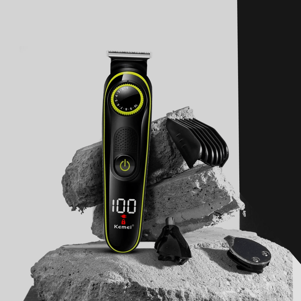 Kemei KM-696 hair trimmer on a concrete background, showcasing a men's grooming kit with adjustable nozzles.