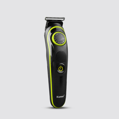 Black and green hair trimmer with Kemei branding on a light gray background