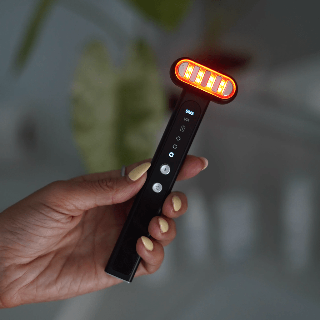 Red Light Therapy Wand for Face & Anti-Aging Device held in hand, featuring glowing red light and control buttons.