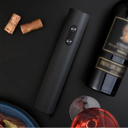 Electric wine opener set displayed with wine bottles and corks on a dark surface.