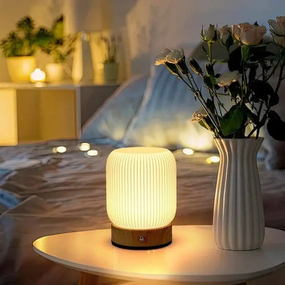 Rechargeable Cordless Mood Lighting For Bedroom And Living Room - Stylish touch lamp beside flowers in cozy ambiance.