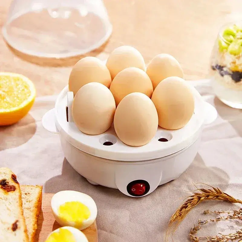 Fast electric egg and veggie cooker with nine eggs in compact design on kitchen countertop.