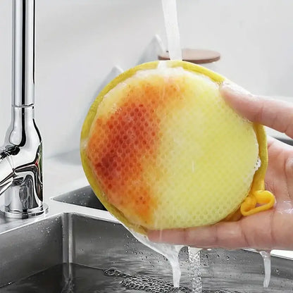 Sponge Scourers – Mess-Free Everyday Cleaning + Dual-Sided Design round yellow sponge scourer rinsed under faucet