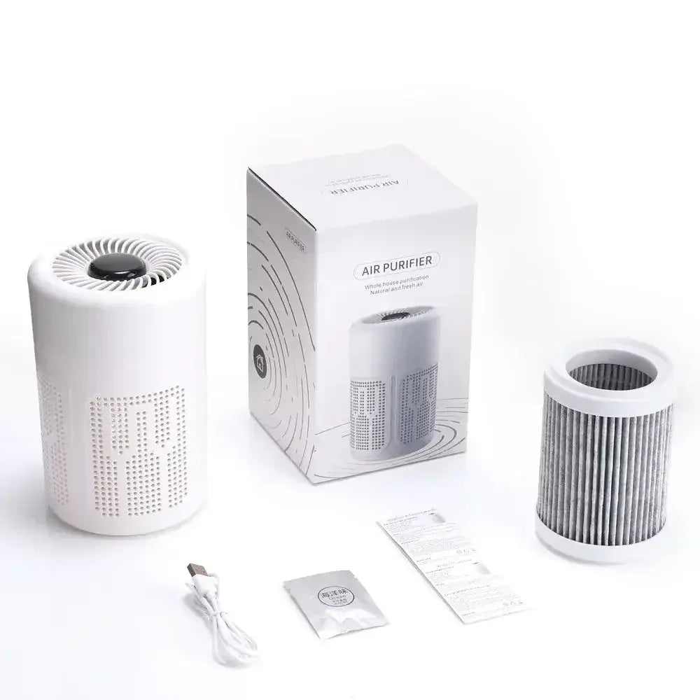 Compact desktop air purifier with HEPA filter, USB power supply, and packaging displayed.