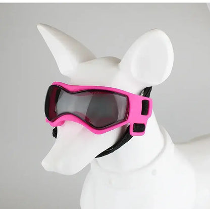 UV Protection Dog Adjustable Sunglasses For Outdoors on a dog model, showcasing pink frame and curved design for eye protection.