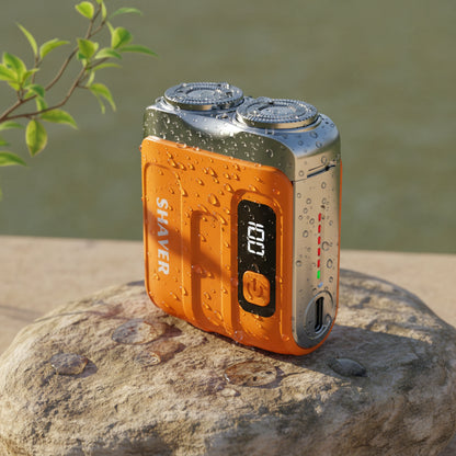 Portable Travel Electric Shaver For Men With Double Floating Magnetic Blade on a rock with droplets of water.