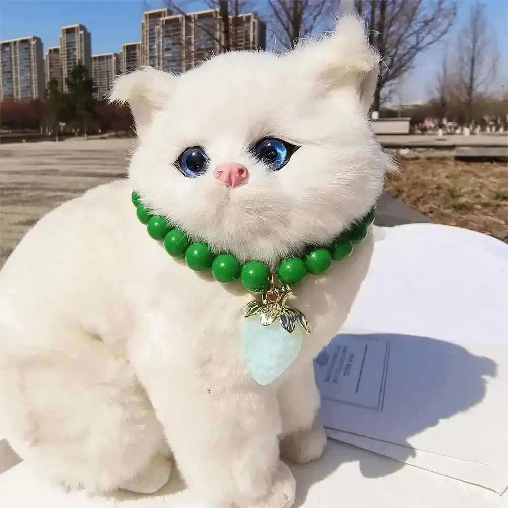 Pet Collar With Pearl Necklace - Pet-Safe Comfort + Lightweight Resin Design For Everyday Wear on white cat with green beads and strawberry pendant