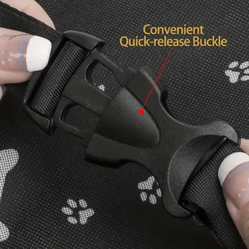 Pet Booster Seat – Safer Rides + Adjustable Seat Belt showing quick-release buckle on breathable paw-print fabric
