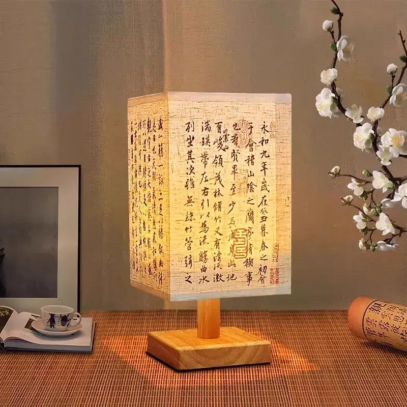 LED table lamp ambient glow with fabric lampshade and wood base for warm lighting in modern decor.