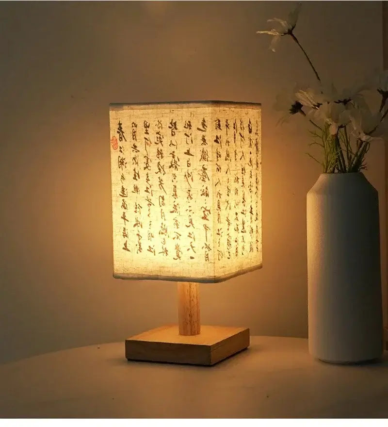 LED table lamp ambient glow with fabric lampshade and wooden base, creating a warm, inviting atmosphere.