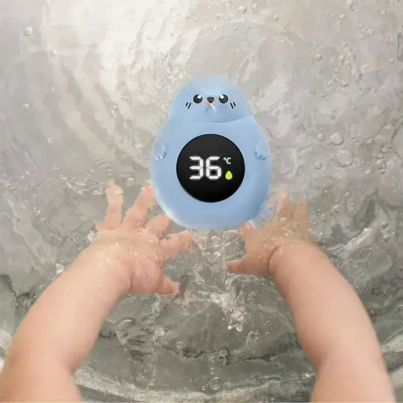 Baby Bath Thermometer - Accurate Readings + LED Display showing 36°C on blue seal-shaped digital tub thermometer