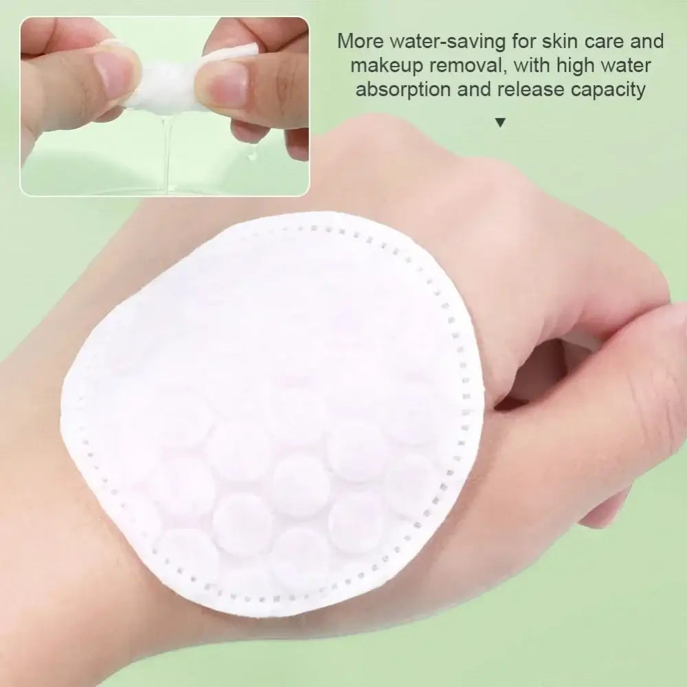 Dual-Sided  Gentle Makeup Removal Cotton Pads on hand showing dual-texture plush and textured sides for makeup removal and toner application
