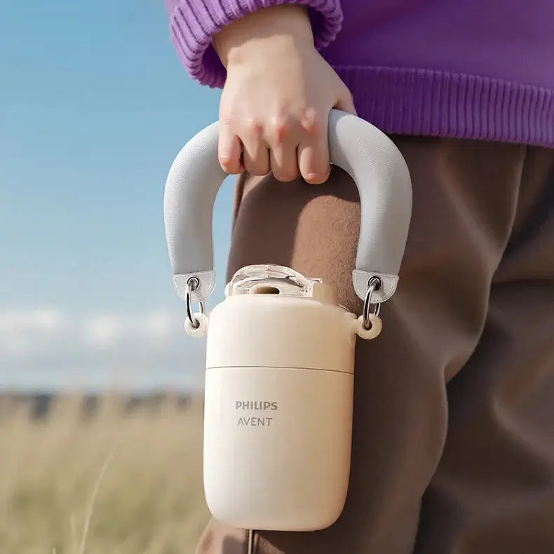 Avent Kids Vacuum Bottle For All-Day Temperature Control carried by a child in a field with a durable design.