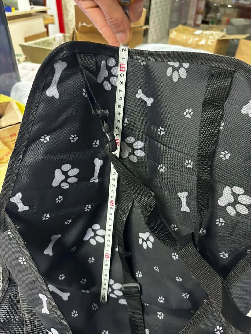 Pet Booster Seat – Safer Rides + Adjustable Seat Belt, black paw-print booster seat interior with measuring tape showing depth