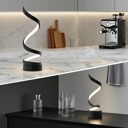 Adjustable brightness LED spiral lamp on marble counter with coffee machine and modern decor.