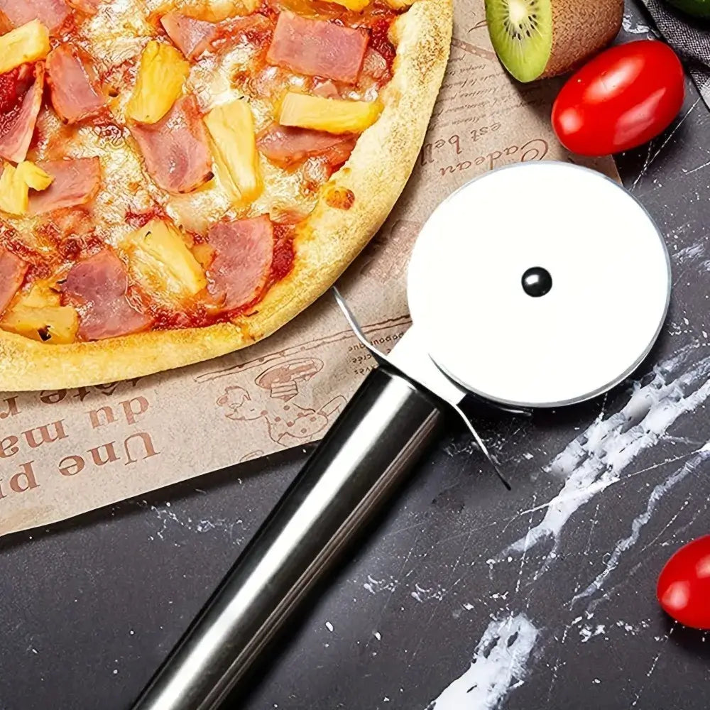 Pizza Cutter Wheel – Mess-Free Slices + Stainless Steel Construction close-up of stainless steel pizza cutter wheel beside pizza