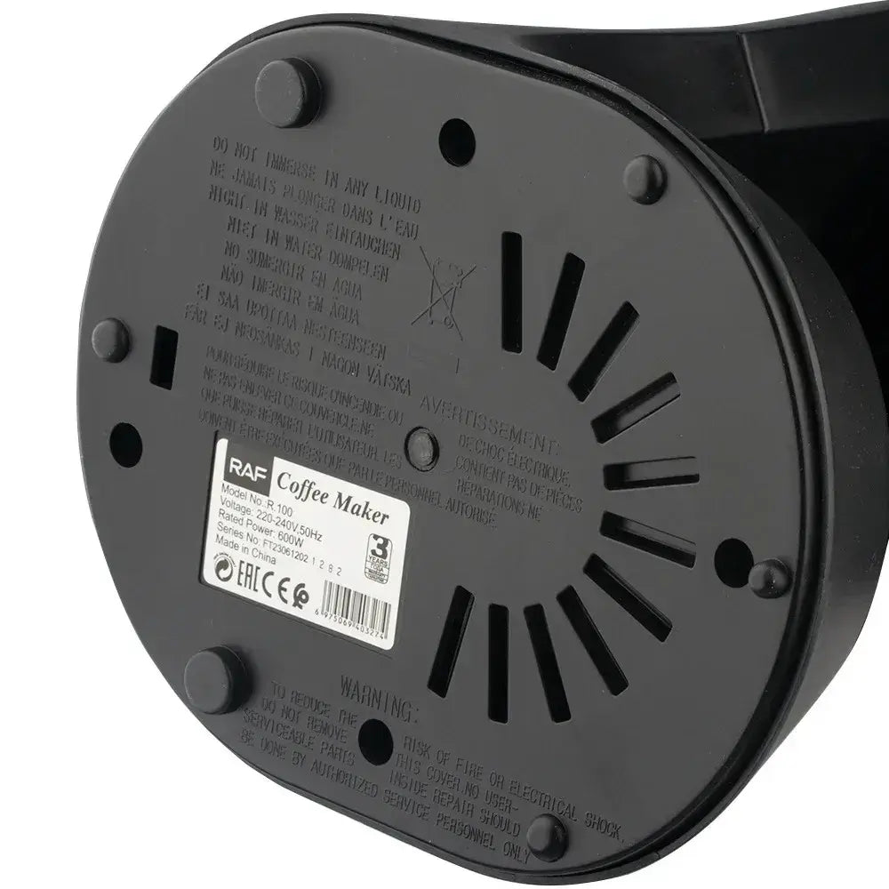 Coffee Maker - Space-Saving Design For Small Kitchens And Dorm Rooms + Reusable Filter And Hot Plate bottom view showing ventilation slots and product label