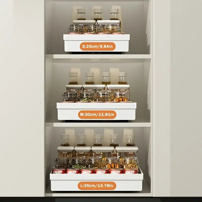 Slide Out Cabinet Organizer No Drill Magic Tray Heavy Duty Space Saver Under Sink – three white sliding trays holding spice jars in a cabinet