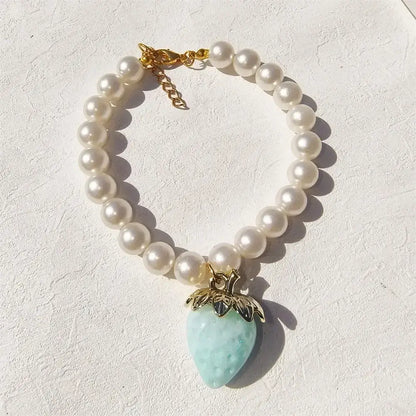 Pet Collar With Pearl Necklace - Pet-Safe Comfort + Lightweight Resin Design For Everyday Wear, pearl beads with strawberry pendant on white background