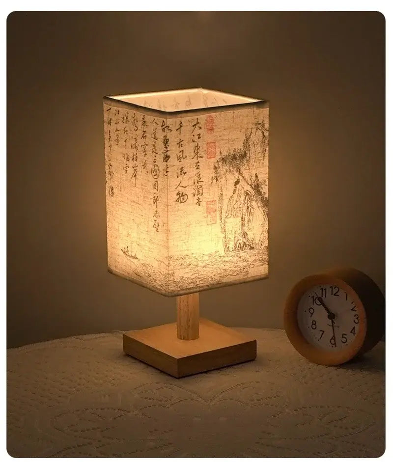 LED table lamp ambient glow with fabric lampshade and wooden base, adding warm light to home decor.