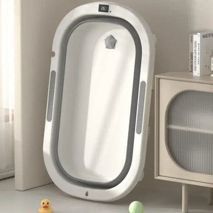 Foldable baby bath tub for toddlers, designed for sitting and lying postures, ideal for household bathroom use.