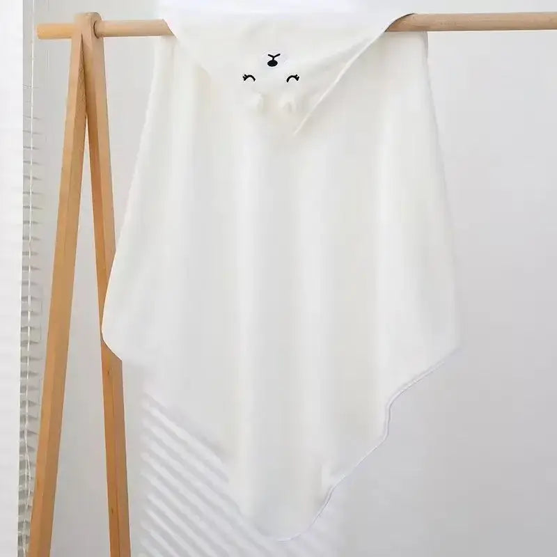 Baby Bath Towel – Gentle On Delicate Baby Skin For Soft, Snug Comfort + Plush Fabric cuddly white animal hooded towel on wooden rack