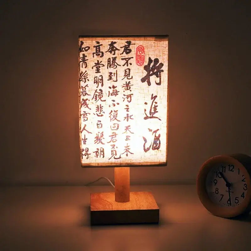 LED table lamp ambient glow with fabric shade and wooden base, creating a warm atmosphere in the room.