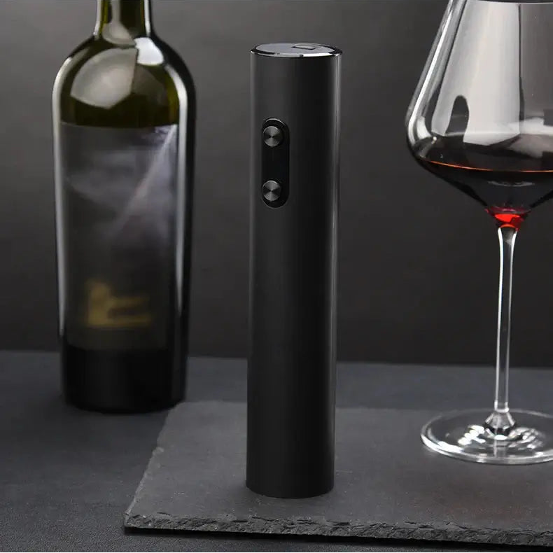 Product display of electric wine opener set next to a wine bottle and glass, showcasing its sleek design.