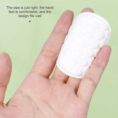 Dual-Sided  Gentle Makeup Removal Cotton Pads shown on fingertip, dual-textured plush and textured sides for makeup removal and cleansing
