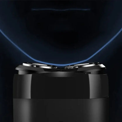 Xiaomi Mijia S100 electric shaver close-up showcasing twin blade system for smooth shaving.
