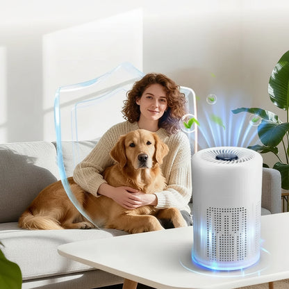 Woman sitting with dog near a compact desktop air purifier, showcasing its air-cleansing features.