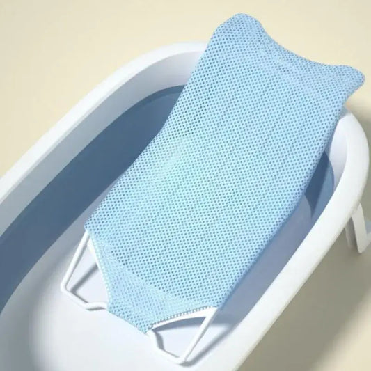 Newborn baby bath net in a soft blue color resting in a baby tub for safe and comfortable bath experience.