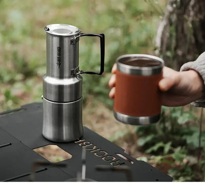 Stainless Steel Moka Pot – Rich Coffee + Foldable Handle on camping stove with hand holding cup
