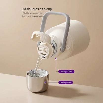 Avent Kids Vacuum Bottle For All-Day Temperature Control with lid doubling as a cup and pouring water.