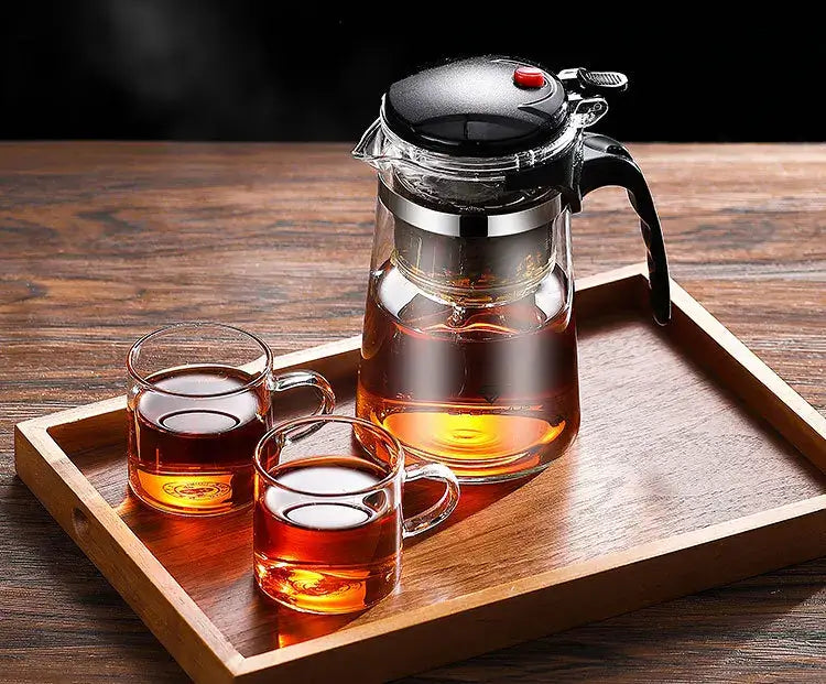 Glass Teapot 1L – Rich Aroma + One-Click Filter System on wooden tray with two glass cups, heat-resistant clear brewing pitcher