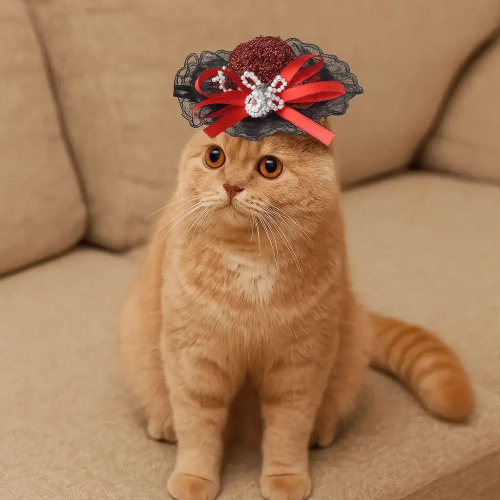 Pet Halloween Hat – Festive Shimmer + Adjustable Elastic Band For Cats And Small Pets; ginger cat wearing British-style sequin lace hat with red bow
