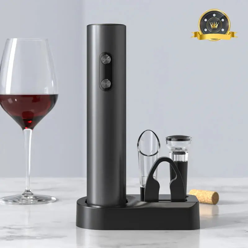 Electric wine opener set with cordless operation, aerator, and foil cutter next to a glass of red wine.