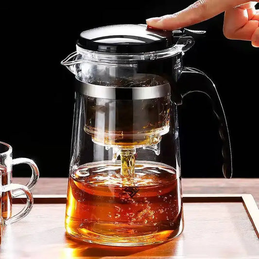 Glass Teapot 1L – Rich Aroma + One-Click Filter System pouring tea with one-click filter