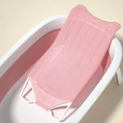 Newborn baby bath net in pink, designed for safe and comfortable bathing of infants.