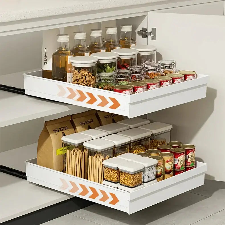 Slide Out Cabinet Organizer No Drill Magic Tray Heavy Duty Space Saver Under Sink in white kitchen cabinet showing slide-out trays with jars and cans