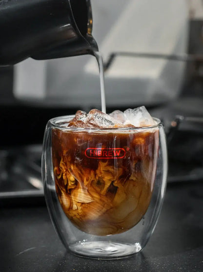 Espresso Machine – Cafe-Quality Espresso With Dense Crema And Rich Body + ESE Pod Compatible: HiBREW iced cappuccino being poured into double-walled glass