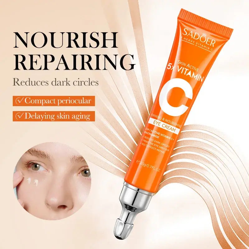 Brightening cream with vitamin-C for dark circles and puffiness - SADOER vitamin C eye cream tube on beige background