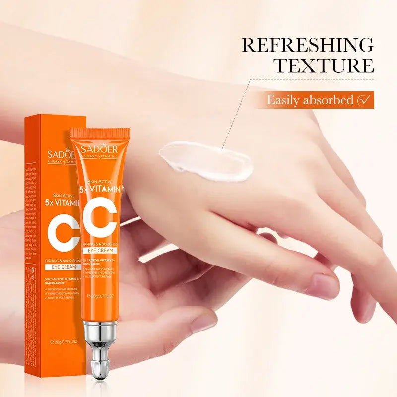 Brightening cream with vitamin-C for dark circles and puffiness - SADOER eye cream tube and moisturizing texture on hand