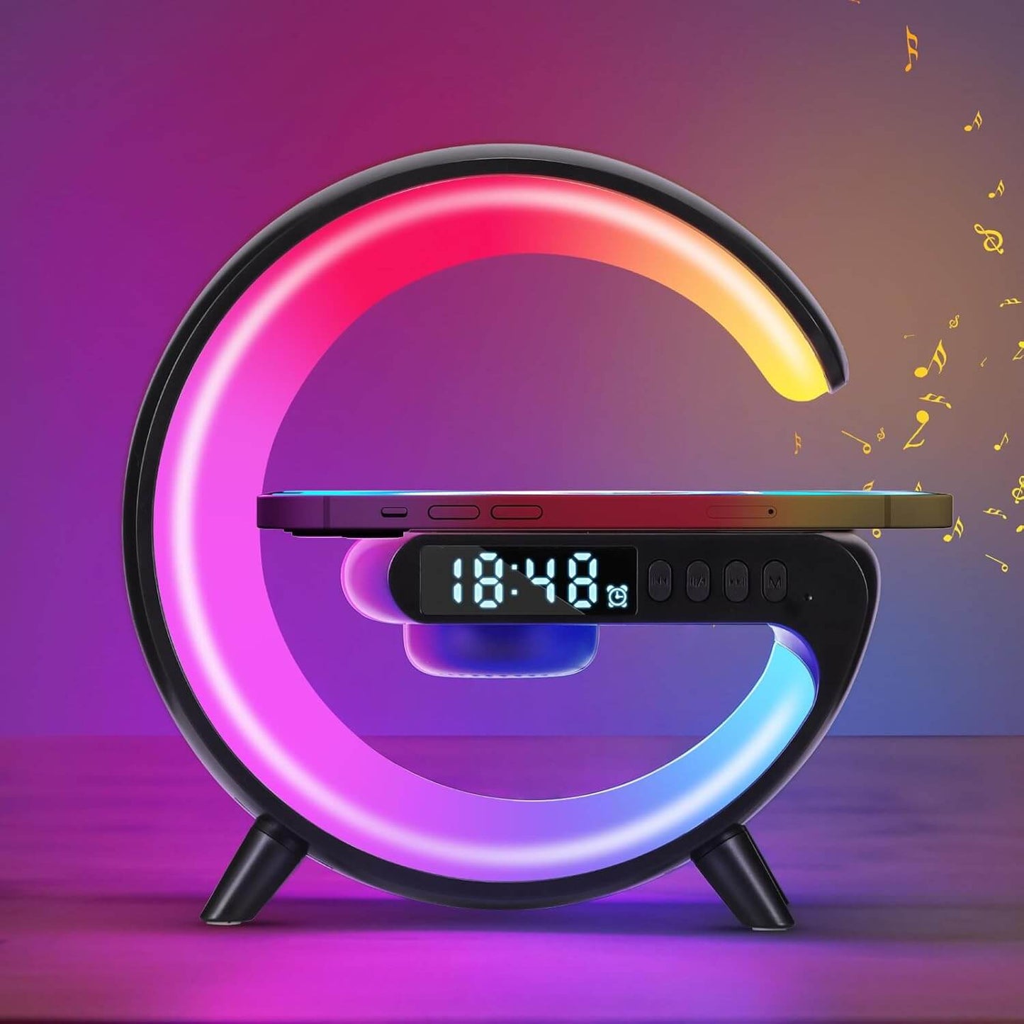 Mini G LED Cord-Free Desk Lamp with Wireless Charging and Speakers showcasing RGB colors and a phone on the charging pad.