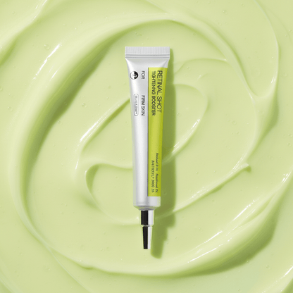 Korean retinol tightening serum on a smooth green backdrop, showcasing its fast-absorbing hydration for radiant skin.